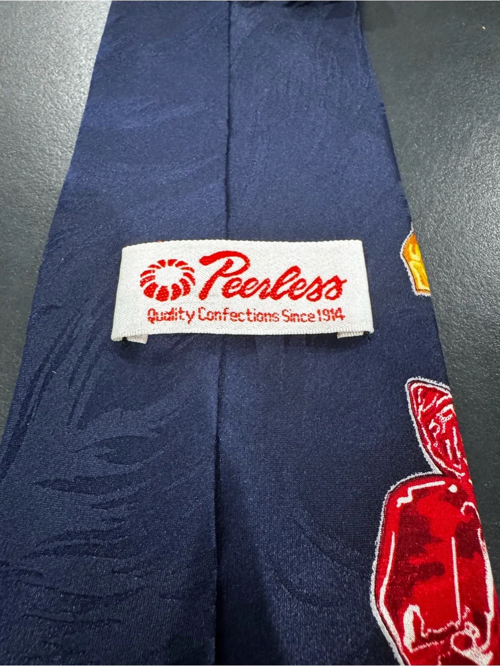 Peerless- Quality Confections Navy Tie with Colorful Candy Print